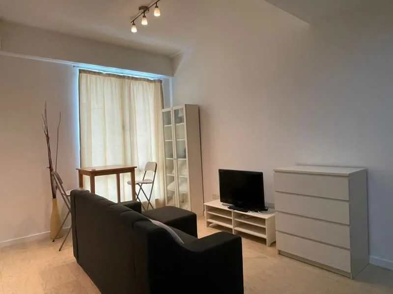 Living features: black fabric sofa, wooden coffee table, white TV console, black TV, white chest of drawers, floor-to-ceiling window, sheer curtains, laminate flooring, decorative branch in vase, folding chair; style: minimalist.