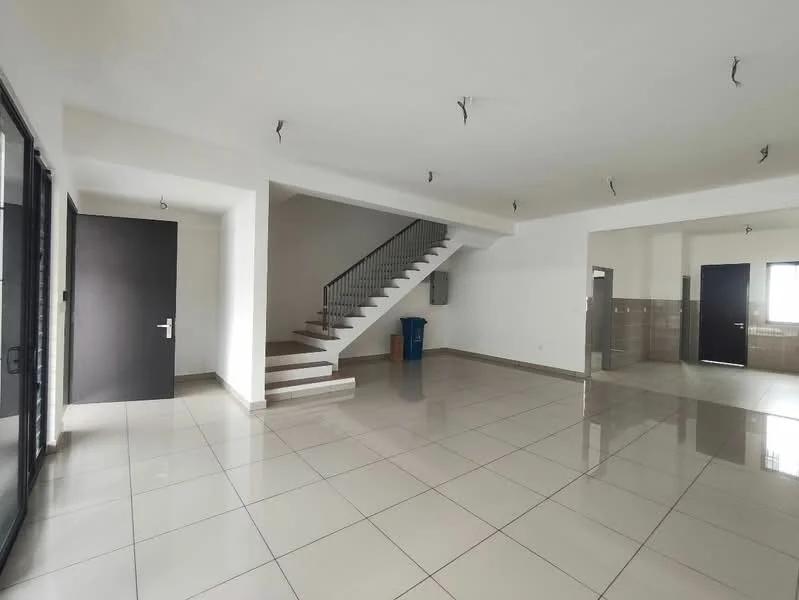 Room features: white painted walls, glossy ceramic tile flooring, staircase with metal railing, large windows, door leading outside, open layout, recessed ceiling lights, corner space for furniture, utility area visible in background, neutral color palette; style: modern.