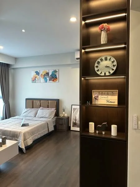 Bedroom features: king-size bed with upholstered headboard, bedside tables, decorative wall clock, framed artwork, floor-to-ceiling windows with curtains, laminate flooring, built-in shelving unit with lighting, area rug, wall-mounted air conditioning unit, light fixtures in ceiling; style: modern.