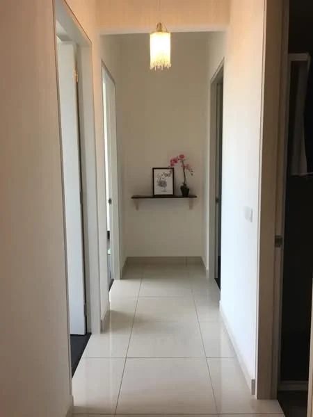 Hallway features: white painted walls, tile flooring, recessed ceiling light, shelf with decorative items, doorways leading to other rooms, decorative plant, framed artwork, neutral color scheme; style: modern.