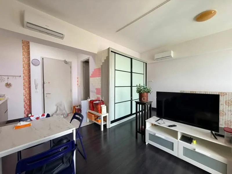 Living features: black wooden flooring, wall-mounted TV, TV console with storage, glass partition wall, 2 wall-mounted split AC units, decorative plant on table, light fixture on ceiling, white walls with accent wallpaper, sofa, dining table with chairs; style: modern.