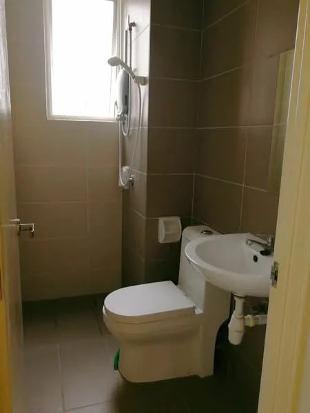 Bathroom features: white toilet, chrome basin mixer faucet, white sink, shower with handheld showerhead, tiled walls in brown, tiled flooring in grey, window for natural light, toilet paper holder; style: modern.