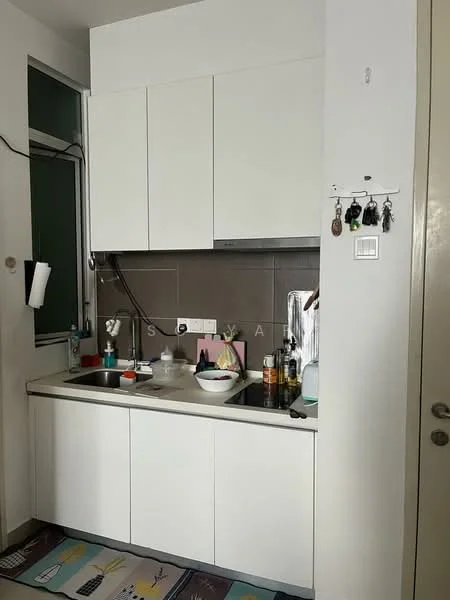 Kitchen features: white cabinetry, grey tiled backsplash, single-bowl stainless-steel sink, chrome pull-down faucet, countertop with integrated sink, built-in stove, kitchen utensils on countertop, wall-mounted hooks for keys, window above sink, floor mat with colorful design; style: modern.