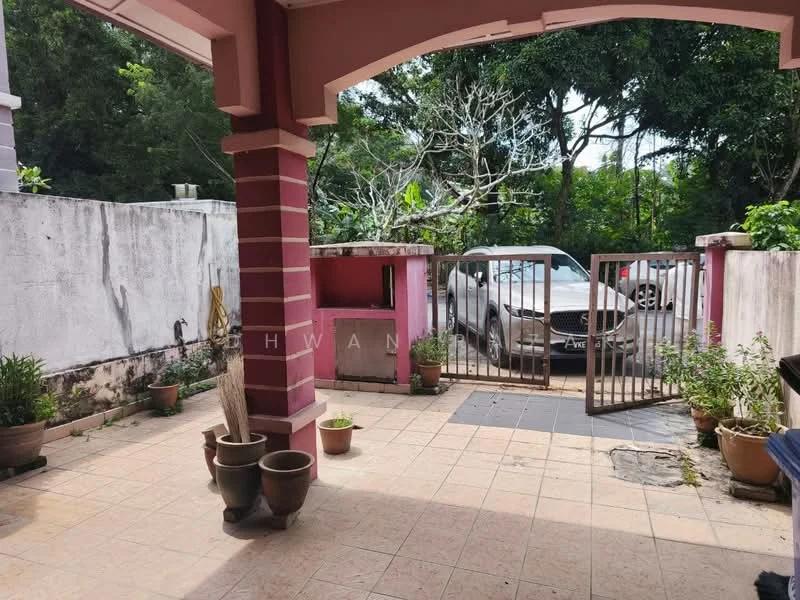 Exterior features: paved flooring, fenced area, car parked in driveway, garden area with potted plants, trees in background, wall with peeling paint, gate at entrance.