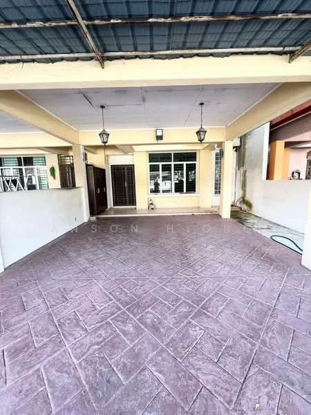 Exterior type: linked terrace house; features: covered porch area, stamped concrete flooring, yellow painted walls, windows with grilles, hanging pendant lights, roof overhang, access to interior door, exterior wall with white paint, visible drainage hose; style: modern.