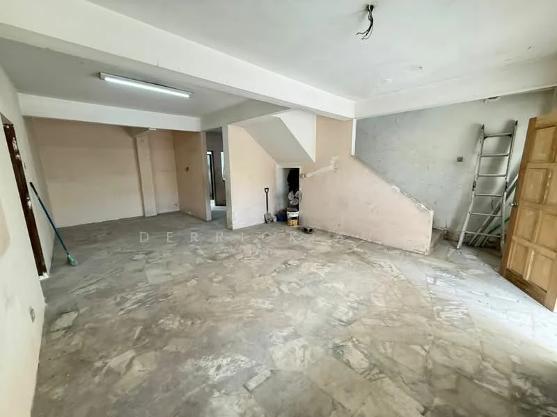 Room features: unfinished walls, light-colored painted walls, exposed ceiling, fluorescent ceiling light, stone flooring, staircase, wooden door, ladder, cleaning tools, open layout; style: minimalist.