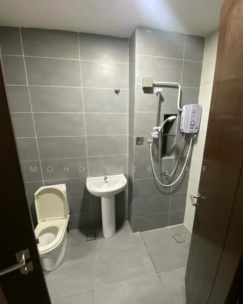 Bathroom features: grey ceramic tile flooring, grey tile walls, white pedestal sink, chrome basin mixer faucet, one-piece toilet, shower area with handheld shower, water heater, wall-mounted mirror; style: modern.