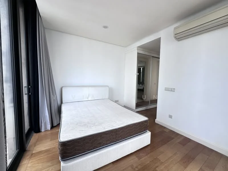Bedroom features: queen-size bed base without mattress, wooden flooring, white painted walls, floor-to-ceiling windows, grey curtains, wall-mounted split AC, mirror in adjacent room, recessed ceiling lights; style: modern.