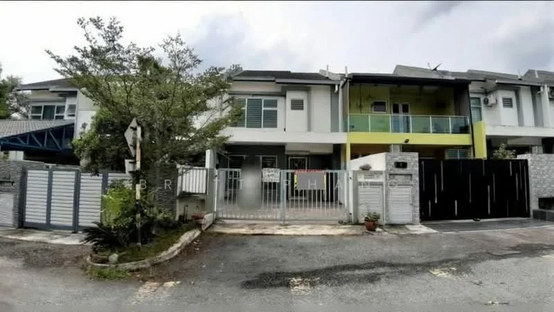 Exterior type: linked terrace house; features: two-storey building, white painted facade, green accent balcony, gated entrance, manicured landscaping, paved driveway, metal gate, front porch area, windows with grills, overhanging eaves; style: modern.