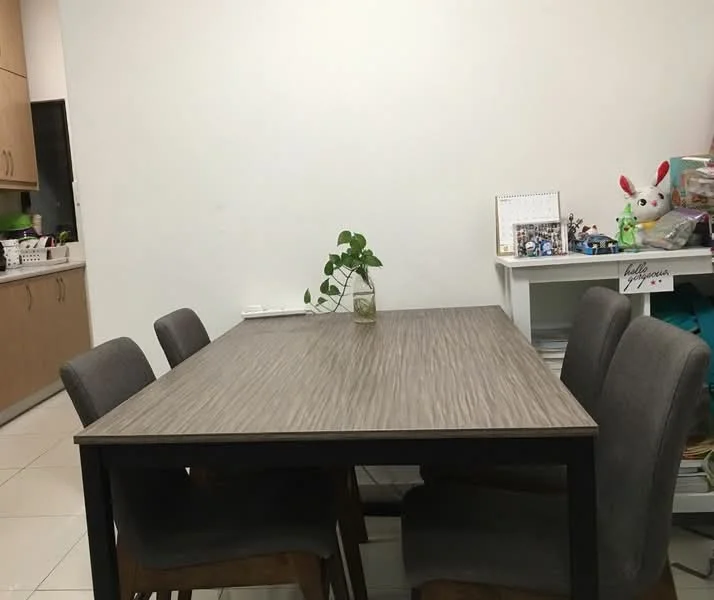 Dining features: rectangular dining table with wood grain finish, 4 grey upholstered dining chairs, white painted walls, tile flooring, decorative plant in glass vase, wall-mounted calendar, framed photographs, open shelving with storage boxes; style: modern.