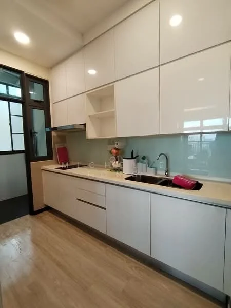 Kitchen features: white cabinetry with flat-panel doors, light-colored countertop, single-bowl stainless-steel sink, chrome pull-down faucet, glass backsplash, built-in oven, stainless-steel range hood, recessed LED downlights, wooden flooring, window with black frame; style: modern.