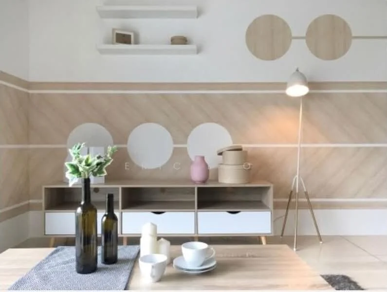Living features: light wood flooring, white painted walls, accent wall with geometric patterns, wooden sideboard with white drawers, decorative vases in various colors, table with white plates and candles, grey textile runner, floor lamp with tripod base; style: modern.