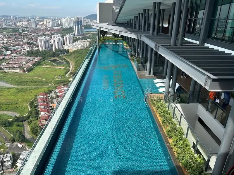 Exterior type: high-rise condominium; features: infinity pool, pool deck with loungers, glass railing, landscaped planters, city skyline view, surrounded by greenery; style: modern.
