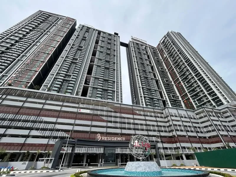 Exterior type: high-rise condominium; features: glass curtain wall, exposed concrete facade, recessed balconies, feature lighting at night, water feature in front, manicured landscaping, multi-storey car park, signage at entrance; style: modern.