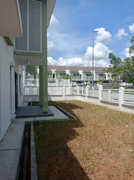 Exterior type: linked terrace house; features: manicured lawn, concrete pathway, white painted facade, green accent wall, fenced yard, surrounded by greenery, two-storey structure, outdoor lighting, paved driveway, adjacent to residential area; style: modern.