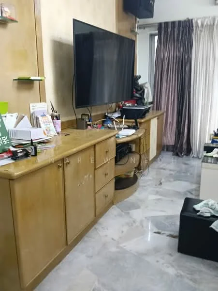 Living features: cream painted walls, marble flooring, wall-mounted TV, wooden TV console, drawers and cabinets, curtains, decorative items on console, messy countertop with various items.