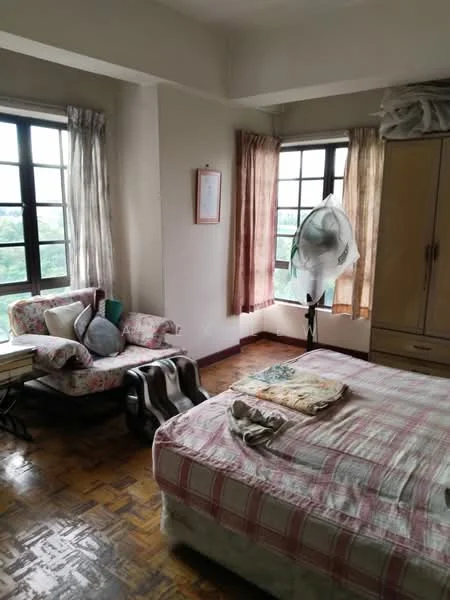 Bedroom features: queen-size bed with checkered bedding, wooden parquet flooring, two large windows with grid pattern, sheer curtains, floral upholstered armchair, wooden wardrobe, decorative wall art, ceiling fan, bedside table, throw pillows; view: garden.