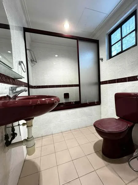 Bathroom features: single-sink vanity with maroon basin, chrome basin mixer faucet, mirror above sink, toilet in maroon, walk-in shower with glass enclosure, tile cladding on walls, cream tiled flooring, recessed lighting, window with frosted glass; style: traditional.