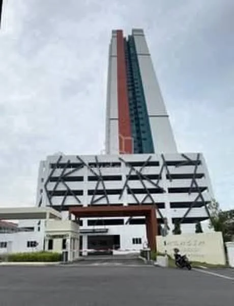 Exterior type: high-rise condominium; features: white painted facade, red and green accent panels, glass curtain wall, projecting balconies, multi-storey car park, landscaped entrance, driveway with interlocking pavers; style: modern.