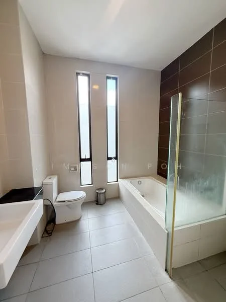 Bathroom features: white ceramic toilet, single-sink vanity with black countertop, bathtub with glass enclosure, shower area with glass partition, grey tile flooring, light grey wall tiles, dark brown accent wall, two vertical windows for natural light; style: modern.