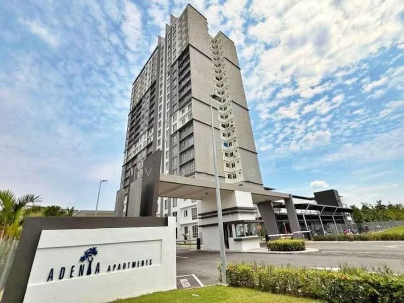 Exterior type: high-rise condominium; features: grey painted facade, glass curtain wall, approximately 15-storey high-rise, manicured lawn, paved walkway, entrance with awning, signage for Adenia Apartments, surrounded by greenery; style: modern.