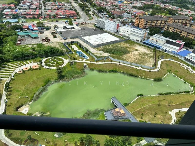 Exterior type: landscape garden; features: manicured lawn, water feature with green water, walking paths, surrounding greenery, adjacent parking area, view of nearby residential buildings, urban context with roads and structures; style: modern.
