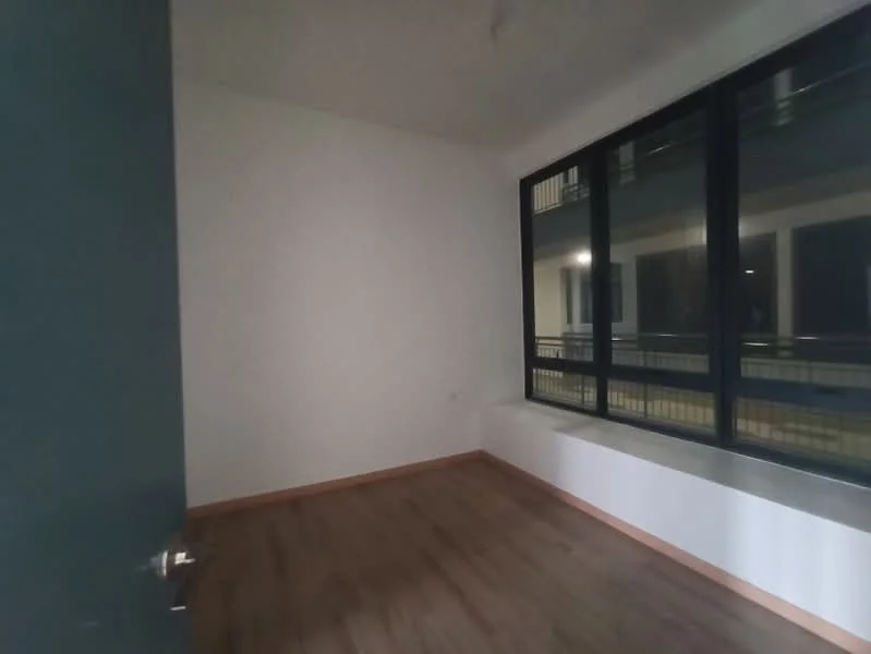 Room features: wooden flooring, white painted walls, large windows, window with view of exterior, door, minimalist design; style: modern.