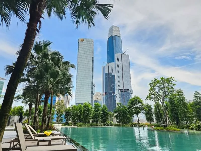 Exterior type: high-rise condominium; features: infinity pool, pool deck with loungers, tropical landscaping, mature palm trees, manicured lawn, city skyline view; style: modern.