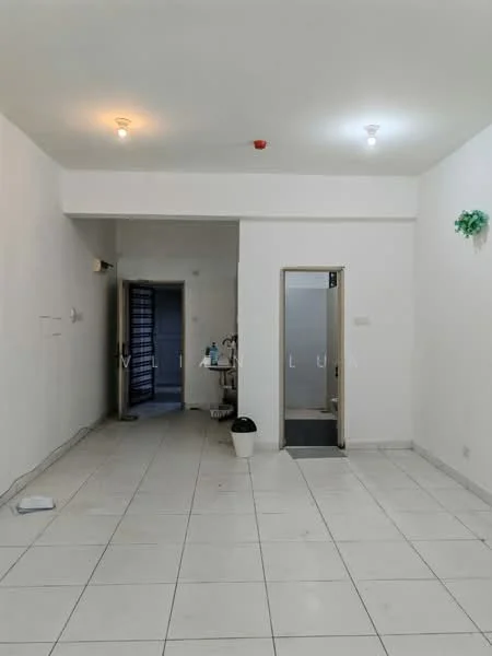 Room features: white painted walls, white ceiling, recessed downlights, tile flooring, doorway leading to another room, doorway leading to bathroom, waste bin, small wall-mounted decor; style: minimalist.