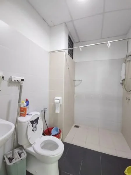 Bathroom features: white tiled walls, light grey tiled flooring, one-piece toilet, wall-mounted shower head, shower area with glass partition, toilet paper holder, cleaning supplies in storage, water heater, small drainage, plastic buckets, shower curtain rod; style: modern.