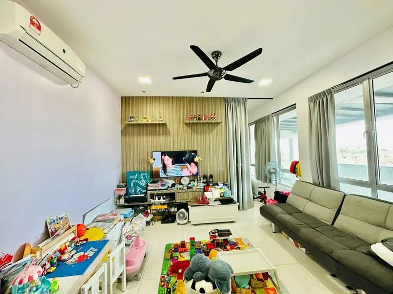 Living features: grey fabric sectional sofa, wall-mounted TV, white TV console, 5-blade ceiling fan with light, white tiled flooring, light purple painted walls, wood panel accent wall, floor-to-ceiling windows, sheer curtains, decorative toys and play area, area rug with colorful pattern, wall-mounted air conditioning unit; style: modern; view: city.