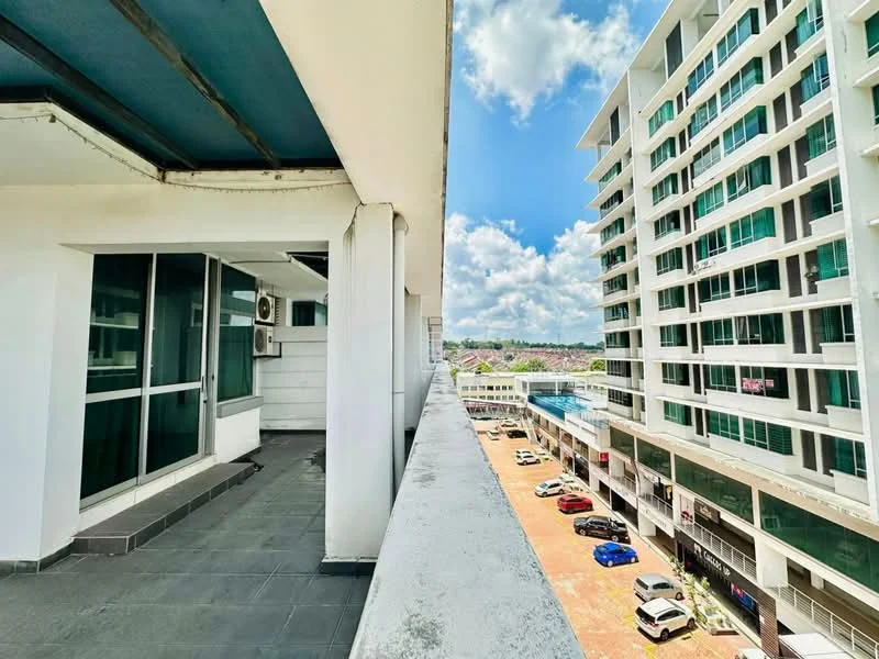 Exterior type: high-rise condominium; features: glass curtain wall, white painted facade, balcony with tiled flooring, visible air conditioning unit, surrounding parking area, urban landscape view, multiple storeys, sunny weather, cloudy sky; style: modern.