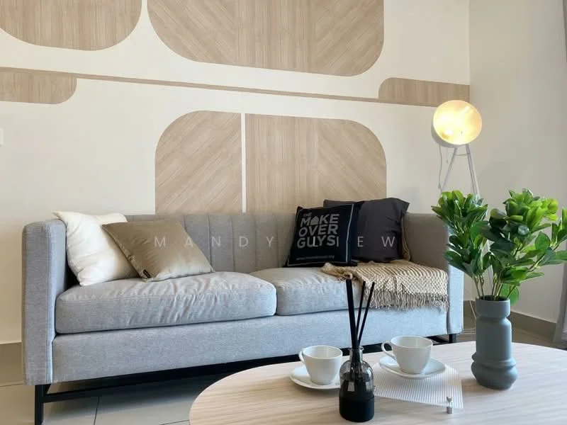 Living features: grey fabric sofa, decorative cushions in black and beige, round wooden coffee table, white ceramic cups, black decorative vase with sticks, green potted plant, floor lamp with round shade, light wood accent wall, cream tiled flooring; style: modern.