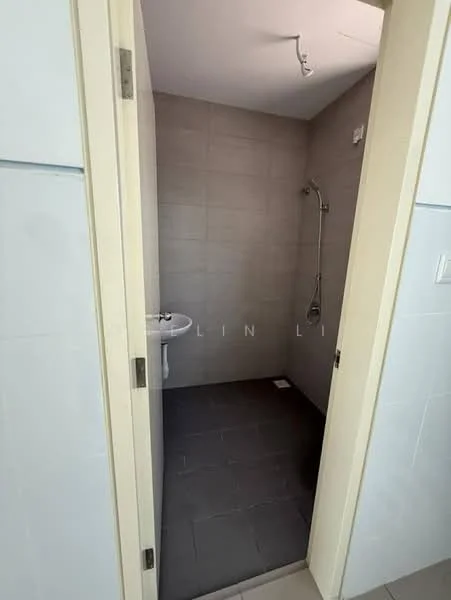Bathroom features: grey tiled walls, grey tiled flooring, shower area with glass partition, wall-mounted shower head, sink with pedestal, chrome faucet, mirror above sink, light fixture on ceiling; style: modern.