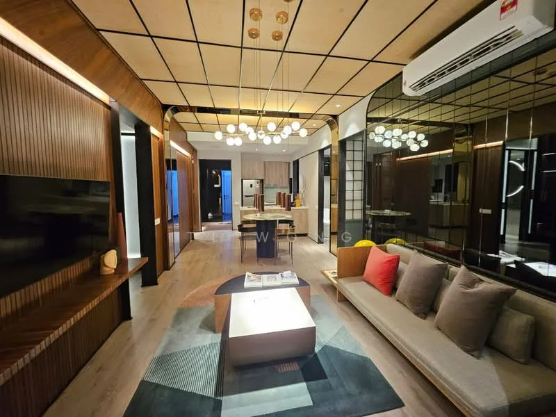 Living features: sofa with grey upholstery, coffee table with wooden top, area rug with geometric pattern, wall-mounted TV, wood paneling on walls, recessed downlights, ceiling with grid pattern, large mirror wall, air conditioning unit, decorative pendant lights, wooden side table, open layout to kitchen, laminate flooring; style: modern. Kitchen features: kitchen island, stainless-steel appliances, open shelving, wood cabinetry, recessed lighting, backlit glass panels; style: modern.