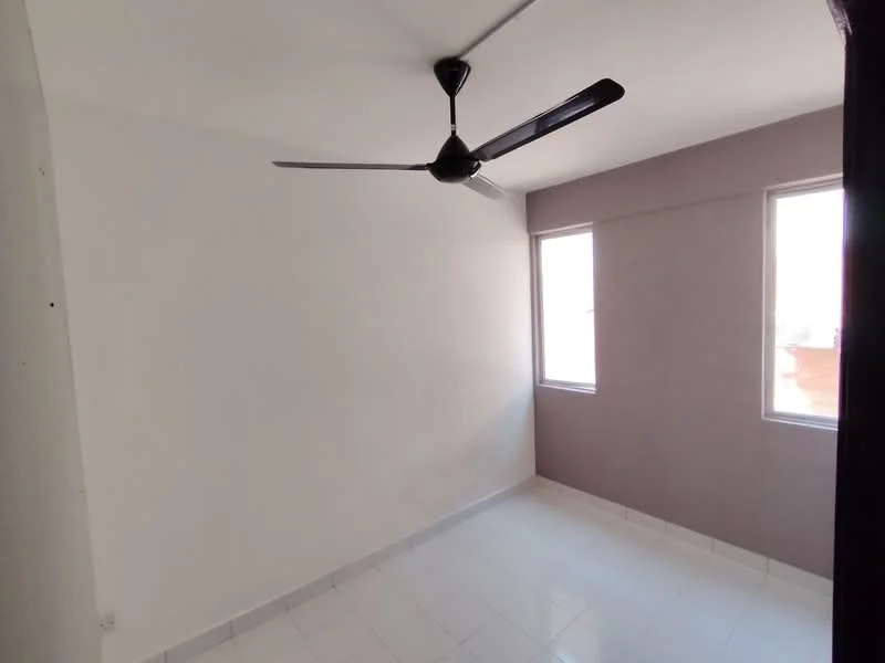 Room features: white painted walls, grey accent wall, glossy white tile flooring, 2 windows, 5-blade ceiling fan, no visible furniture, natural light from windows; style: modern.