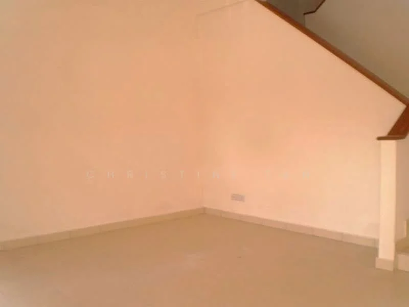 Room features: light beige painted walls, white tiled flooring, staircase with wooden handrail, corner space, no visible furniture, natural light from nearby window.