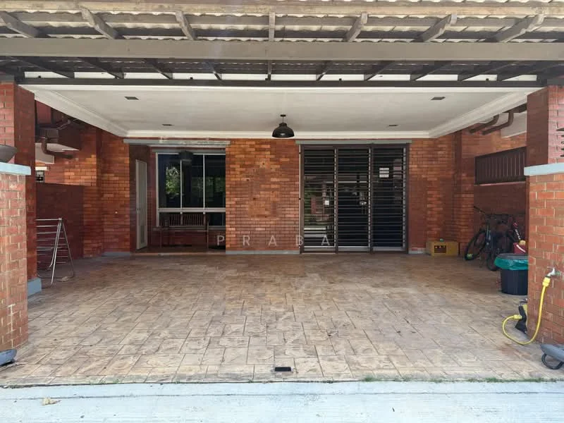 Exterior type: car porch; features: brick facade, flat roof with overhang, stamped concrete flooring, sliding glass door, security grilles, outdoor lighting, bicycle storage, water hose, manicured landscaping, open-air parking space; style: modern.