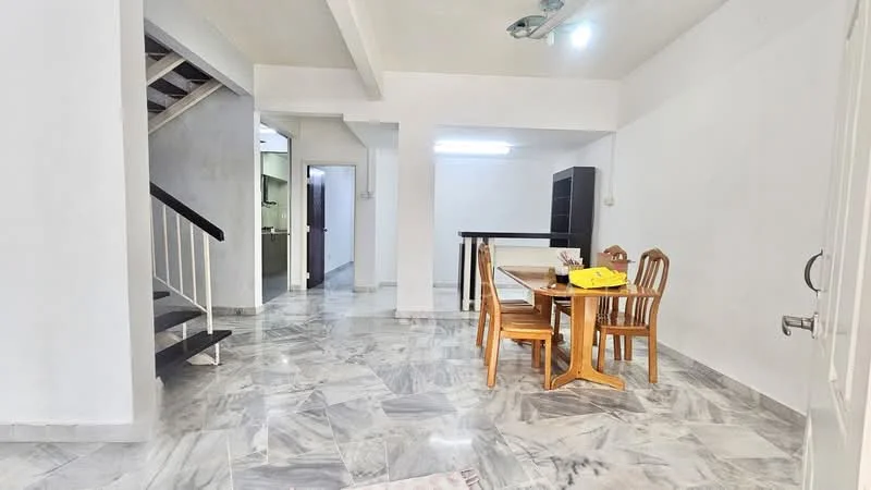 Living features: marble flooring, white painted walls, ceiling with recessed lighting, dining table with four wooden chairs, open layout, staircase with wooden railing, wall-mounted shelves, large window for natural light; style: modern. Room features: white painted walls, marble flooring, ceiling with fluorescent lighting.