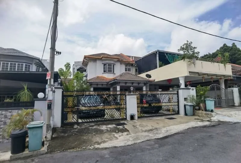 Exterior type: detached bungalow; features: two-storey house, tiled roof, white painted facade, black wrought iron gate, manicured lawn, paved driveway, surrounded by greenery, front porch with seating, decorative stone wall, outdoor lighting fixtures; style: modern.