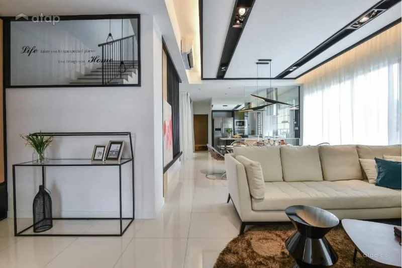 Living features: cream fabric sofa, black coffee table, white walls, recessed downlights, floor-to-ceiling windows with sheer curtains, decorative wall art, open layout to kitchen, polished tile flooring, decorative plant in pot, black metal shelving unit, framed photographs, area rug with geometric pattern; style: modern. Kitchen features: open kitchen layout, stainless-steel appliances, island countertop, white cabinetry, recessed lighting, marble countertop, bar stools, backlit shelving; style: modern.