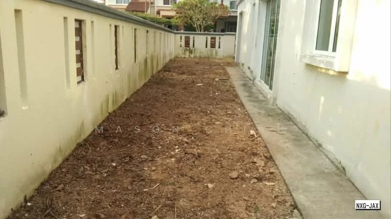 Exterior features: bare soil, concrete pathway, white painted walls, fenced area, adjacent to residential buildings, no visible landscaping.