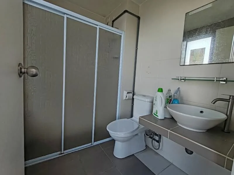 Bathroom features: glass shower enclosure, toilet, sink with countertop, mirror above sink, faucet, wall-mounted shelf, grey tile flooring, white tiled walls; style: modern.