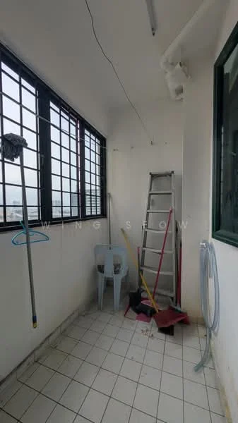 Room features: white painted walls, tiled flooring, large windows with black metal frames, cleaning ladder, plastic chair, mop, hanging clothes rack, hose, broom, red mat.