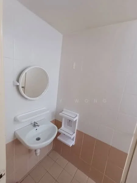 Bathroom features: white tiled walls, light beige tiled flooring, round mirror, wall-mounted sink, chrome faucet, toilet paper holder, soap dispenser, shelf for toiletries.