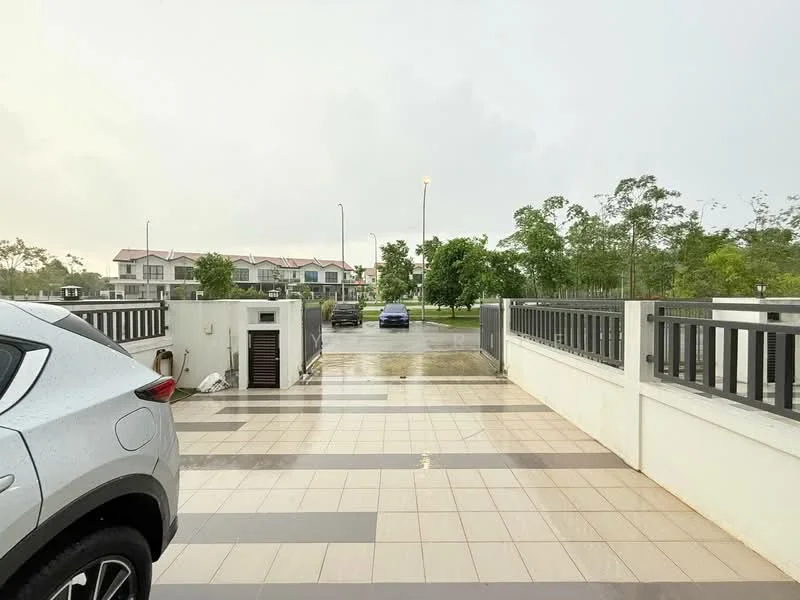 Exterior type: linked terrace house; features: paved driveway, white painted fence, manicured lawn, street lighting, surrounding greenery, two parked cars, residential buildings in background; style: modern.