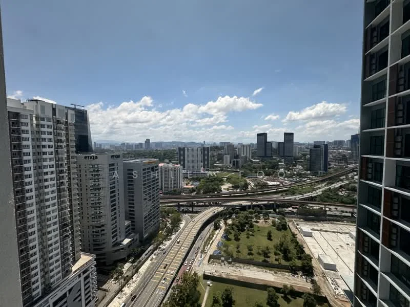 Exterior type: high-rise condominium; features: city skyline view, surrounded by urban development, highway visible, green park area, multiple high-rise buildings, clear blue sky, clouds, road infrastructure; style: modern.