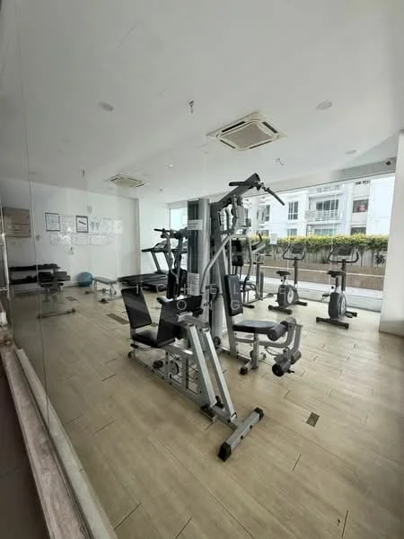 Gym features: weight training machine, exercise bike, treadmill, mirror wall, wooden flooring, air conditioning unit, large windows, exercise mat, free weights, fitness posters on walls; style: modern; view: garden.