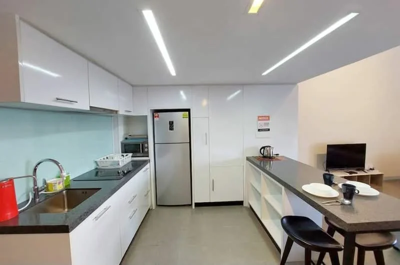 Kitchen features: white cabinetry, black granite countertop, stainless-steel fridge, built-in oven, 4-burner gas hob, single-bowl stainless-steel sink, chrome pull-down faucet, open shelving, kitchen island with seating, recessed LED downlights, grey tile flooring; style: modern.