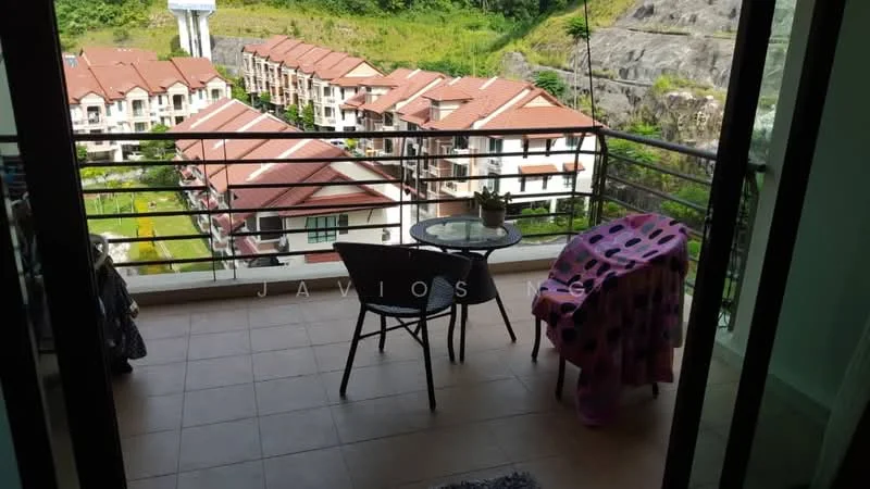 Balcony features: tile flooring, glass railing, outdoor table, single chair, view of surrounding buildings, view of greenery, decorative plant, pink patterned throw, sliding glass door access; view: garden.